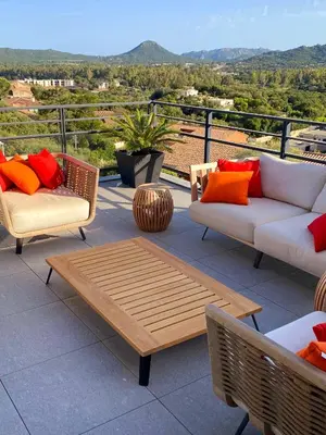 a patio with two couches and a coffee table at Roof Top AVRETTU - Vue Panoramique & Design in Porto-Vecchio