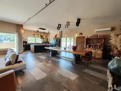 a large living room with a table and a couch at Villa KECA in Bonifacio