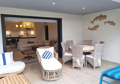 a room with a table and chairs and a living room at Domaine d'Arca - Hugo 01 - 5 personnes in Porto-Vecchio