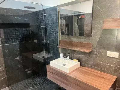 a bathroom with a tub and a table and chairs at Villa moderne piscine vue mer in Ajaccio