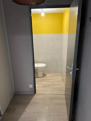 an open door to a bathroom with a toilet at Tosca opéra in Ajaccio