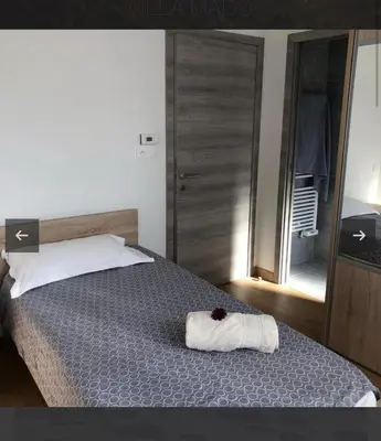 a bedroom with a bed with a white towel on it at Villa Mado 4 Bedrooms, Pool, 6 Personnes, Ste Lucie de Porto Vecchio in Zonza