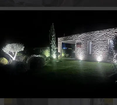 a house with lights in the yard at night at Villa Mado 4 Bedrooms, Pool, 6 Personnes, Ste Lucie de Porto Vecchio in Zonza