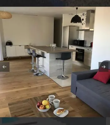 a kitchen and living room with a couch and a table at Villa Mado 4 Bedrooms, Pool, 6 Personnes, Ste Lucie de Porto Vecchio in Zonza