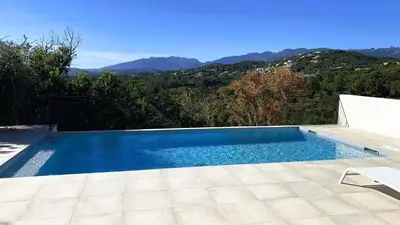 a swimming pool with a view of the mountains at Villa Casalonga, 8 pers, piscine chauffée, 1km plage in Cirendinu