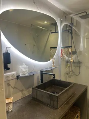 a bathroom with a sink and a mirror at Villa avec piscine et vue sur la baie d'Ajaccio in Ajaccio