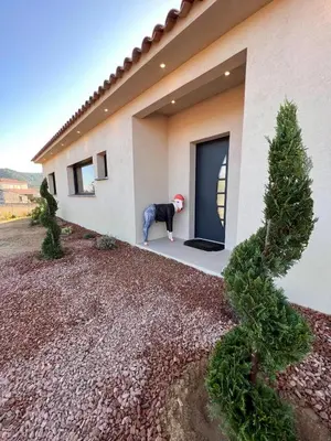 a man standing in front of a house at Casa Cagna, 3 bedrooms, Heated pool, 8people in Figari