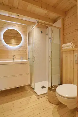 a bathroom with a shower and a toilet and a sink at Chalet Alivi in Porto-Vecchio