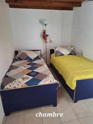 a bedroom with two beds in a room at Appartement 