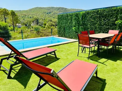 a patio with chairs and a table and a pool at Villa Corail- Piscine privée- Corsu di Core in Conca