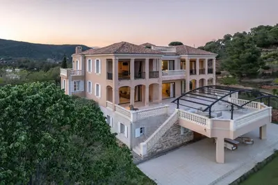 an aerial view of a large house with a balcony at Château di Cardiccia a Luxury 7-Bedroom Villa with Air Conditioning in Zonza