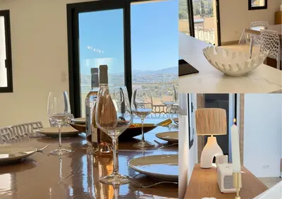 a table with glasses and plates on a table at Villa familiale avec piscine,15 min des plages in Lavatoggio