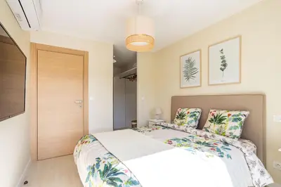 a bedroom with a bed and a closet at Villa Oia - avec piscine privée in Conca