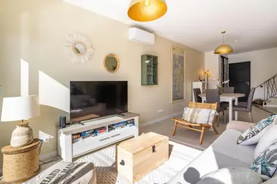a living room with a large flat screen tv at Villa Oia - avec piscine privée in Conca