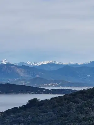 a view of a body of water with snow covered mountains at Large Family Villa, exceptional sea view in Coti-Chiavari