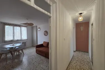a living room with a couch and a table at Quiet flat in Ajaccio neat beaches and downtown in Ajaccio