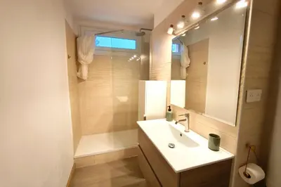 a bathroom with a sink and a mirror at Quiet flat in Ajaccio neat beaches and downtown in Ajaccio