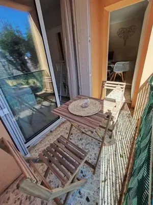 a bathroom with a toilet and a sink and a washing machine at Quiet flat in Ajaccio neat beaches and downtown in Ajaccio
