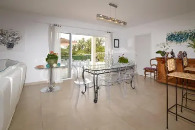 a dining room with a glass table and chairs at Villa Piscine Mer 7 min Vue Montagne Clim in Prunelli-di-Fiumorbo