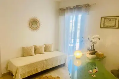 a bedroom with a bed and a glass table at Villa Piscine Mer 7 min Vue Montagne Clim in Prunelli-di-Fiumorbo