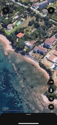 an aerial view of a beach with houses and the ocean at Appartement T2 jardin & accès plage privée in Grosseto-Prugna