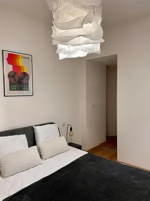 a bedroom with a bed and a white ceiling at Village centre appartement in Calenzana