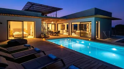 a villa with a swimming pool and a house at Villa Maria 1. 12 pers, piscine chauffée, 5 min plage in Cirendinu