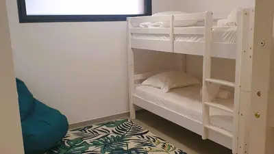 a room with a bunk bed with a bunk bed gmaxwell gmaxwell gmaxwell gmaxwell at Villa Maria 1. 12 pers, piscine chauffée, 5 min plage in Cirendinu