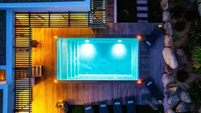 an overhead view of a swimming pool at night at Villa Maria 1. 12 pers, piscine chauffée, 5 min plage in Cirendinu