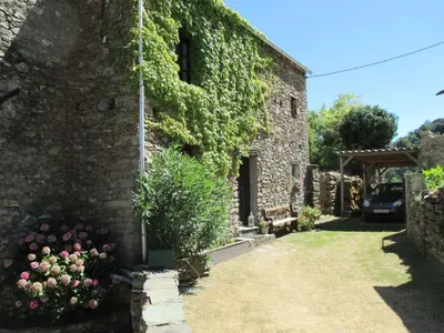a stone house with ivy on the side of it at Apartment Sole e Ventu 30qm by Interhome in San-Giovanni-di-Moriani