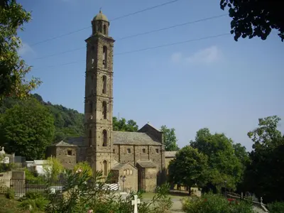 an old church with a clock tower on top at Apartment Sole e Ventu 30qm by Interhome in San-Giovanni-di-Moriani
