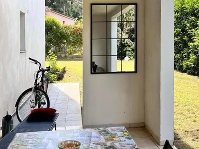 a mirror on the wall of a house with a bike at Apartment Résidence Amanda by Interhome in Santa-Lucia-di-Moriani