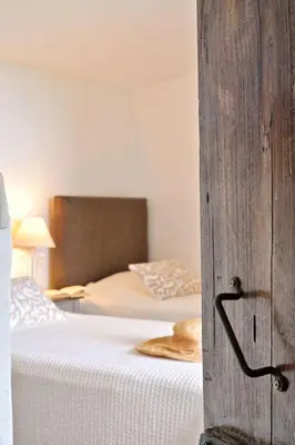 a bedroom with a bed and a bed sidx sidx sidx at Holiday Home Domaine Punta della Guardia Maison A Figa mit Blick auf das Meer by Interhome in Cervione