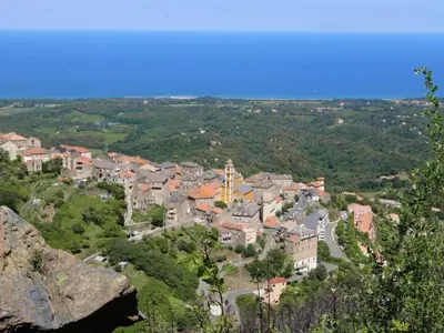 a small town in the middle of a city at Holiday Home Weingut Punta della guardia zwischen Meer und Gebirge by Interhome in Cervione