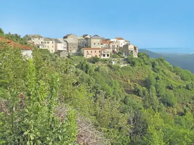 a group of houses on top of a hill at Holiday Home Weingut Punta della guardia zwischen Meer und Gebirge by Interhome in Cervione