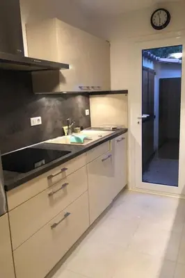 a kitchen with a sink and a counter top at Holiday Home Casa zinu mit Blick aufs Meer by Interhome in Cargèse