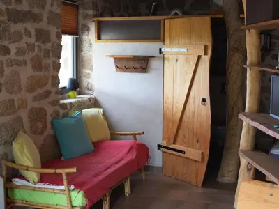 a small room with a bench and a door at Holiday Home in idyllischer Lage im Süden Korsikas by Interhome in Serra-di-Ferro