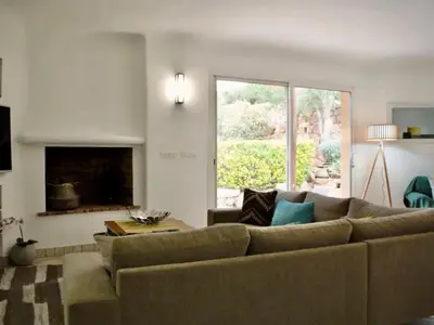 a living room with a couch and a fireplace at Holiday Home Luxusvilla aus Stein Concadoro by Interhome in Porto-Vecchio