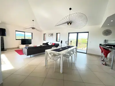 a living room with a white table and chairs at Holiday Home Villa Santa Giulia in Porto-Vecchio by Interhome in Porto-Vecchio