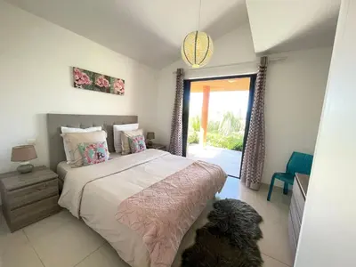 a bedroom with a bed and a dog in it at Holiday Home Villa Santa Giulia in Porto-Vecchio by Interhome in Porto-Vecchio