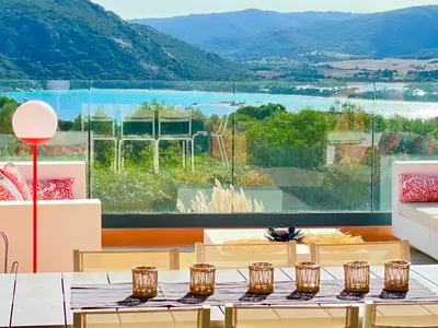 a room with two tables and a large window at Holiday Home Villa Santa Giulia in Porto-Vecchio by Interhome in Porto-Vecchio
