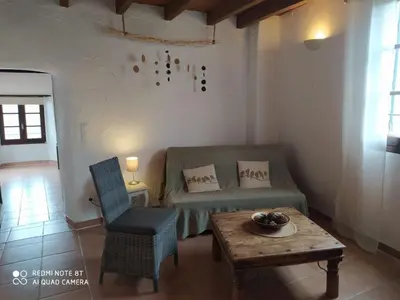 a living room with a couch and a table at Apartment Sole e Ventu 50qm by Interhome in San-Giovanni-di-Moriani