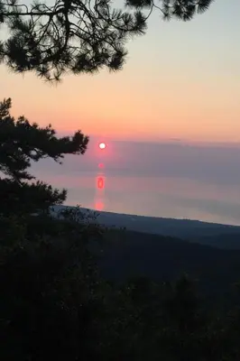 a sunset over the ocean with the sun in the sky at Holiday Home Villa Belle Vue- direkt am Meer- 1-2 Haustiere erlaubt by Interhome in Cervione