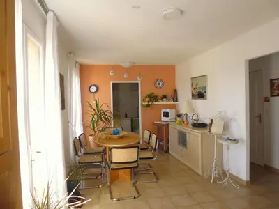 a kitchen with a table and chairs in a room at Holiday Home Villa Miramonte by Interhome in Venzolasca
