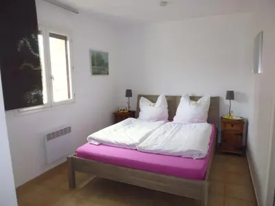 a bedroom with a bed with a purple mattress at Holiday Home Villa Miramonte by Interhome in Venzolasca