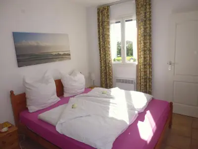 a bedroom with a bed with white sheets and a window at Holiday Home Villa Miramonte by Interhome in Venzolasca