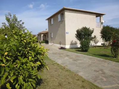 a house with a stone driveway in front of it at Holiday Home Villa Miramonte by Interhome in Venzolasca
