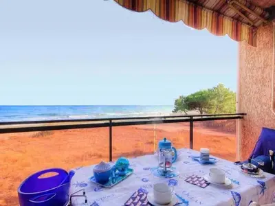 a table with a view of the beach and the ocean at Apartment Blaue Flucht Korsika by Interhome in San-Nicolao