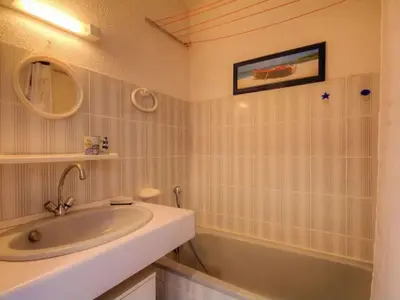 a bathroom with a sink and a bath tub at Apartment Blaue Flucht Korsika by Interhome in San-Nicolao