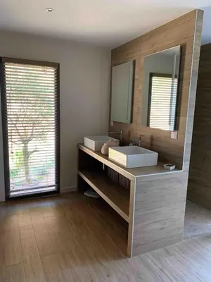 a bathroom with a sink and a mirror at La Villa K, plage du Ruppione in Pietrosella